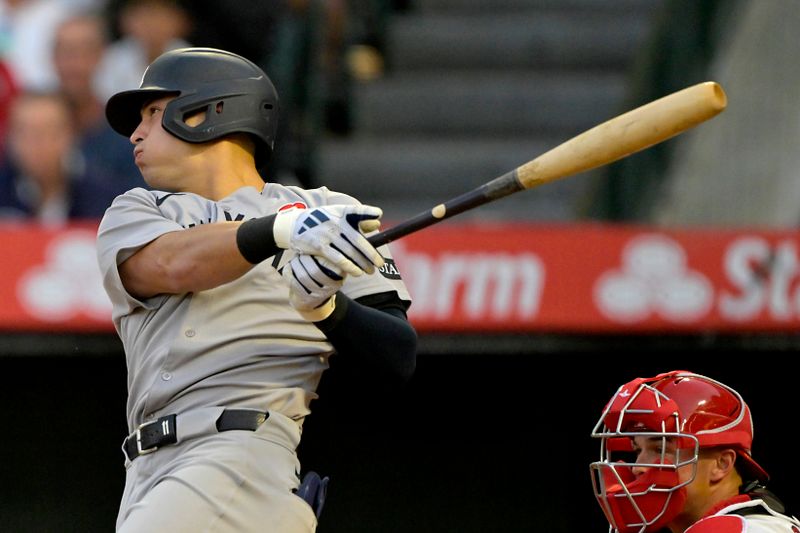 May 26, 2025; Anaheim, California, USA;  New York Yankees shortstop Anthony Volpe (11) doubles in three runs in the fourth inning against the Los Angeles Angels at Angel Stadium. Mandatory Credit: Jayne Kamin-Oncea-Imagn Images