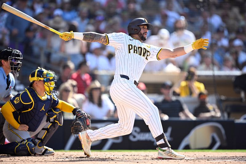 Jun 22, 2024; San Diego, California, USA; San Diego Padres right fielder David Peralta (24) hits a single during the second inning against the Milwaukee Brewers at Petco Park. Mandatory Credit: Orlando Ramirez-USA TODAY Sports