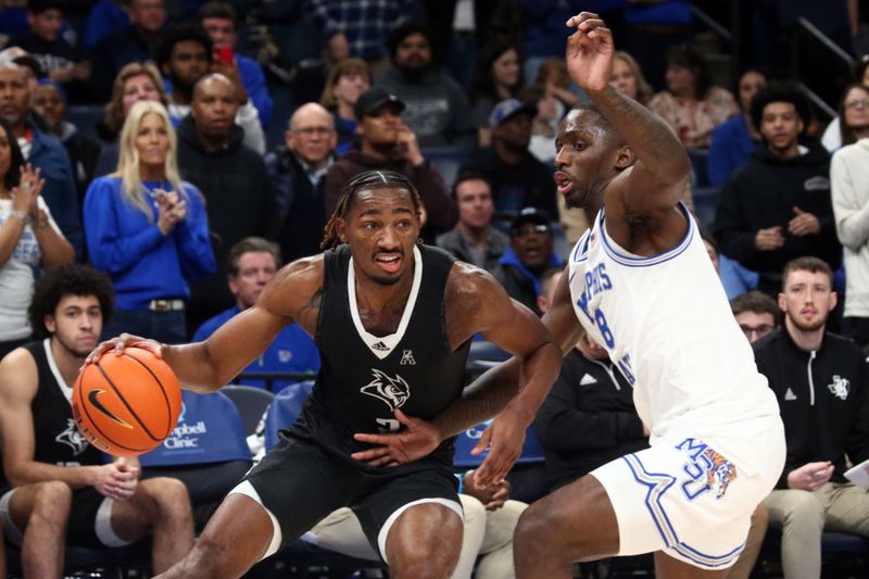 Jan 31, 2024; Memphis, Tennessee, USA; Rice Owls guard Mekhi Mason (2) drives to the basket as Memphis Tigers forward David Jones (8) defends during the second half at FedExForum. Mandatory Credit: Petre Thomas-USA TODAY Sports