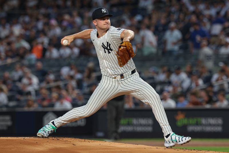 Sep 13, 2024; Bronx, New York, USA; New York Yankees starting pitcher Clarke Schmidt (36) delivers a pitch during the first inning against the Boston Red Sox at Yankee Stadium. Mandatory Credit: Vincent Carchietta-Imagn Images