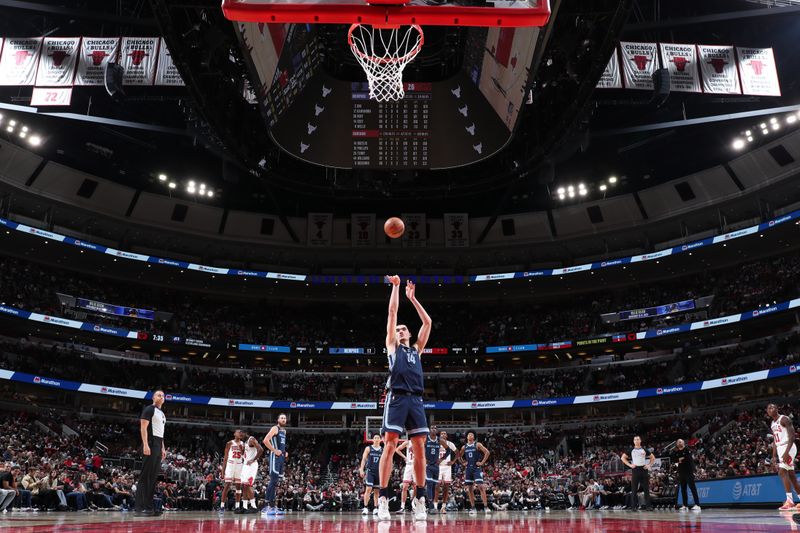 CHICAGO, IL - OCTOBER 12: Zach Edey #14 of the Memphis Grizzlies shoots a free throw during the game against the Chicago Bulls during a NBA preseason game on October 12, 2024 at United Center in Chicago, Illinois. NOTE TO USER: User expressly acknowledges and agrees that, by downloading and or using this photograph, User is consenting to the terms and conditions of the Getty Images License Agreement. Mandatory Copyright Notice: Copyright 2024 NBAE (Photo by Jeff Haynes/NBAE via Getty Images)