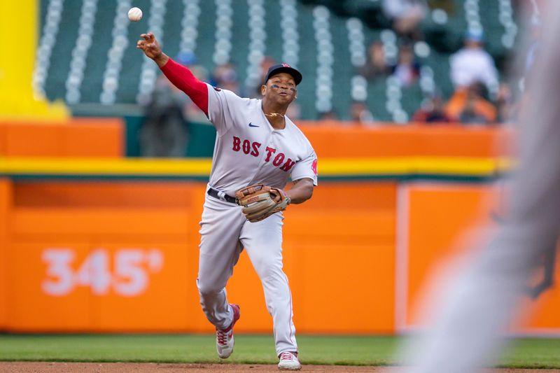 Apr 11, 2022; Detroit, Michigan, USA; Boston Red Sox third baseman Rafael Devers (11) makes a throw to first base for an out during the fourth inning against the Detroit Tigers at Comerica Park. Mandatory Credit: Raj Mehta-USA TODAY Sports