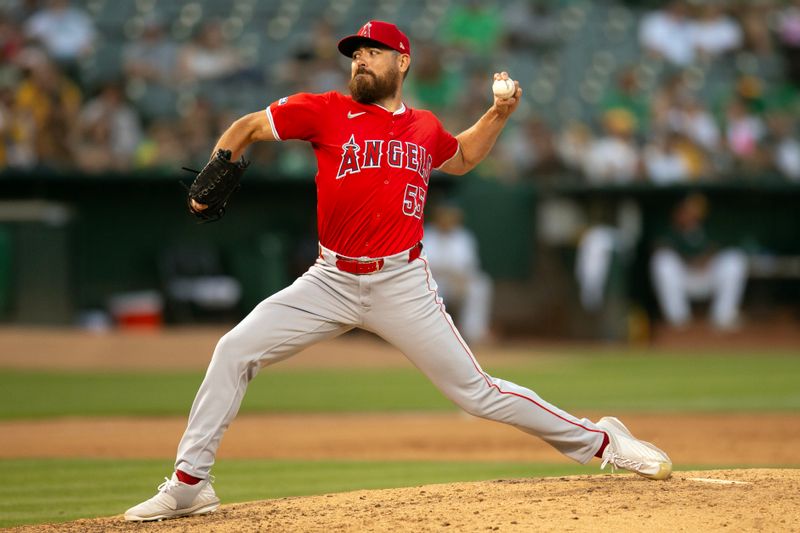 Jul 3, 2024; Oakland, California, USA; Los Angeles Angels pitcher Matt Moore (55) delivers a pitch against the Oakland Athletics during the sixth inning at Oakland-Alameda County Coliseum. Mandatory Credit: D. Ross Cameron-USA TODAY Sports