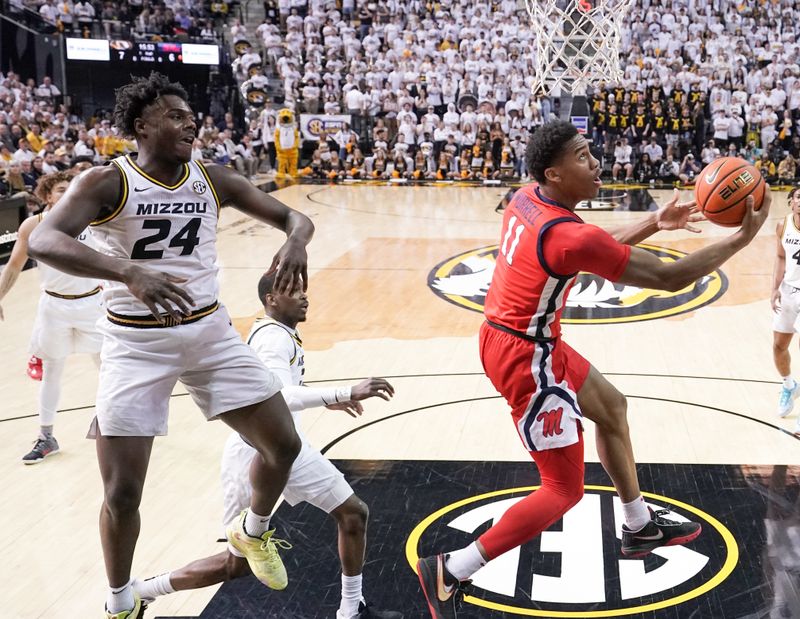 Mar 4, 2023; Columbia, Missouri, USA; Mississippi Rebels guard Matthew Murrell (11) shoots a layup as Missouri Tigers guard Kobe Brown (24) defends during the first half at Mizzou Arena. Mandatory Credit: Denny Medley-USA TODAY Sports