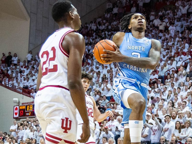 Nov 30, 2022; Bloomington, Indiana, USA; North Carolina Tar Heels guard Caleb Love (2) shoots the ball while Indiana Hoosiers forward Jordan Geronimo (22) defends in the second half  at Simon Skjodt Assembly Hall. Mandatory Credit: Trevor Ruszkowski-USA TODAY Sports