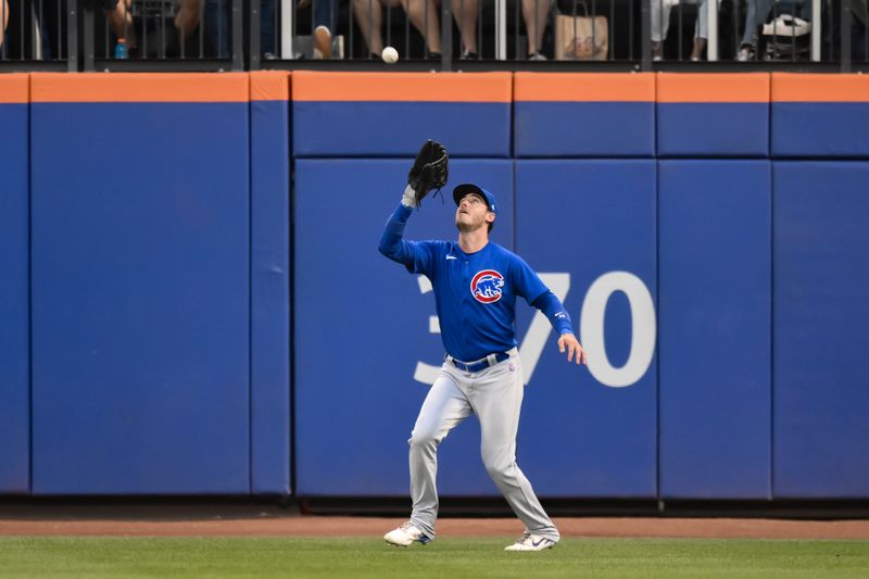 Aug 9, 2023; New York City, New York, USA; Chicago Cubs center fielder Cody Bellinger (24) catches a fly ball against the New York Mets during the second inning at Citi Field. Mandatory Credit: John Jones-USA TODAY Sports