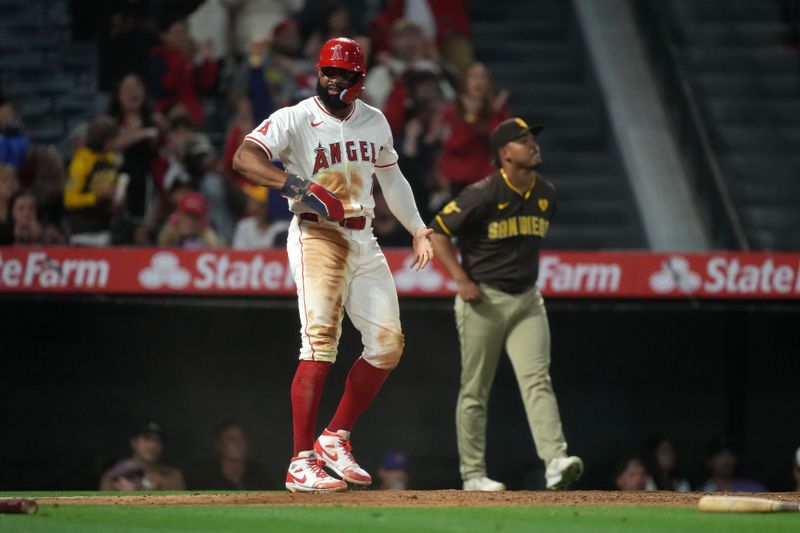 Jun 3, 2024; Anaheim, California, USA; Los Angeles Angels right fielder Jo Adell (7) celebrates after scoring in the eight inning against the San Diego Padres at Angel Stadium. Mandatory Credit: Kirby Lee-USA TODAY Sports