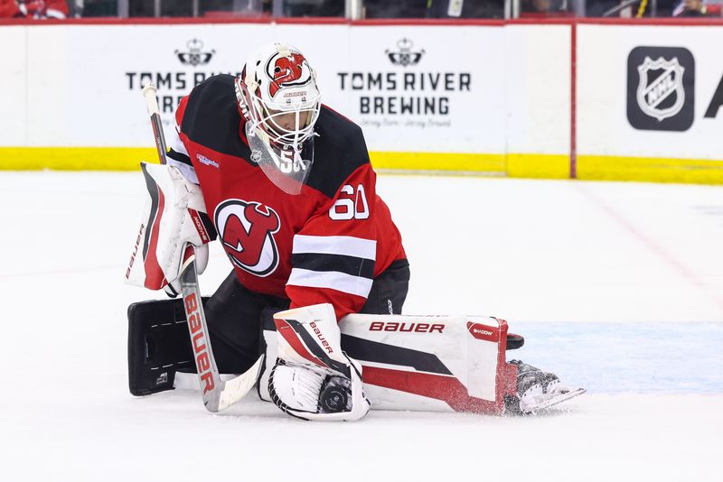 Sep 30, 2024; Newark, New Jersey, USA; New Jersey Devils goaltender Jeremy Brodeur (60) makes a save against the New York Rangers during the third period at Prudential Center. Mandatory Credit: Ed Mulholland-Imagn Images