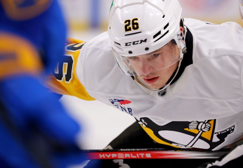 Sep 21, 2024; Buffalo, New York, USA;  Pittsburgh Penguins center Tristan Broz (26) waits for the face-off during the first period against the Buffalo Sabres at KeyBank Center. Mandatory Credit: Timothy T. Ludwig-Imagn Images