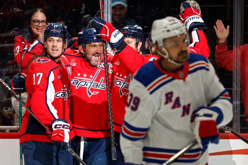 Oct 29, 2024; Washington, District of Columbia, USA; Washington Capitals left wing Alex Ovechkin (8) celebrates with teammates after scoring a goal against the New York Rangers in the first period at Capital One Arena. Mandatory Credit: Geoff Burke-Imagn Images