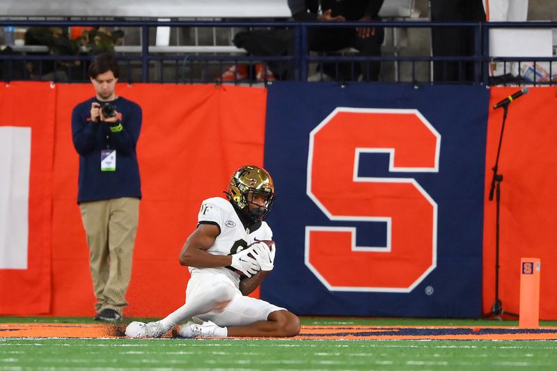 Nov 25, 2023; Syracuse, New York, USA; Wake Forest Demon Deacons wide receiver Wesley Grimes (8) catches the ball for a two-point conversion against the Syracuse Orange during the second half at the JMA Wireless Dome. Mandatory Credit: Rich Barnes-USA TODAY Sports