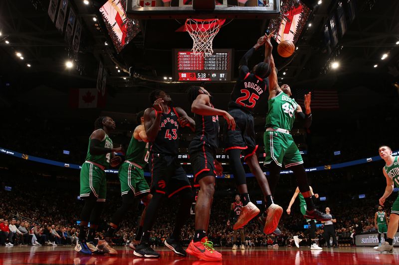 TORONTO, CANADA - JANUARY 15:  Al Horford #42 of the Boston Celtics and Chris Boucher #25 of the Toronto Raptors battle for a rebound on January 15, 2024 at the Scotiabank Arena in Toronto, Ontario, Canada.  NOTE TO USER: User expressly acknowledges and agrees that, by downloading and or using this Photograph, user is consenting to the terms and conditions of the Getty Images License Agreement.  Mandatory Copyright Notice: Copyright 2024 NBAE (Photo by Vaughn Ridley/NBAE via Getty Images)