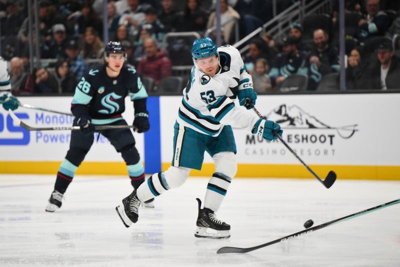 Nov 30, 2024; Seattle, Washington, USA; San Jose Sharks center Ty Dellandrea (53) passes the puck against the Seattle Kraken during the third period at Climate Pledge Arena. Mandatory Credit: Steven Bisig-Imagn Images