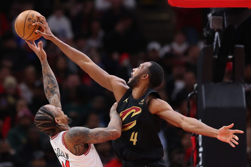 CHICAGO, ILLINOIS - FEBRUARY 28: Evan Mobley #4 of the Cleveland Cavaliers blocks a shot by DeMar DeRozan #11 of the Chicago Bulls during the first half at the United Center on February 28, 2024 in Chicago, Illinois. NOTE TO USER: User expressly acknowledges and agrees that, by downloading and or using this photograph, User is consenting to the terms and conditions of the Getty Images License Agreement. (Photo by Michael Reaves/Getty Images)