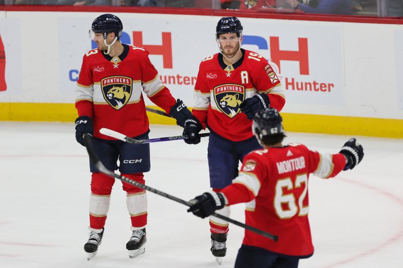 Feb 27, 2024; Sunrise, Florida, USA; Florida Panthers left wing Matthew Tkachuk (19) celebrates with center Sam Reinhart (13) and defenseman Brandon Montour (62) after scoring against the Buffalo Sabres during the first period at Amerant Bank Arena. Mandatory Credit: Sam Navarro-USA TODAY Sports