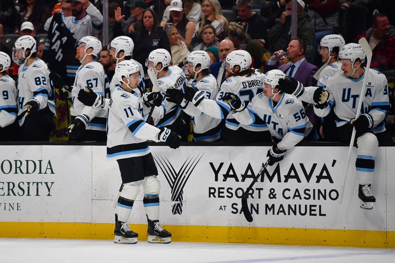 Dec 3, 2025; Anaheim, California, USA; Utah Mammoth right wing Dylan Guenther (11) celebrates his goal scored against the Anaheim Ducks during the first period at Honda Center. Mandatory Credit: Gary A. Vasquez-Imagn Images