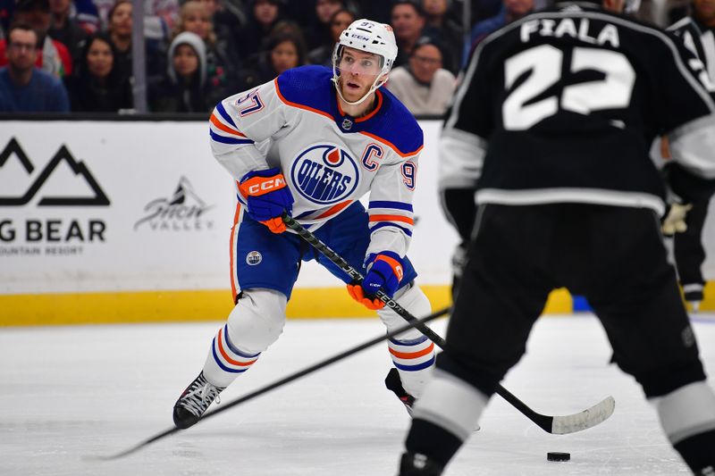 Dec 30, 2023; Los Angeles, California, USA; Edmonton Oilers center Connor McDavid (97) controls the puck against the Los Angeles Kings during the third period at Crypto.com Arena. Mandatory Credit: Gary A. Vasquez-USA TODAY Sports