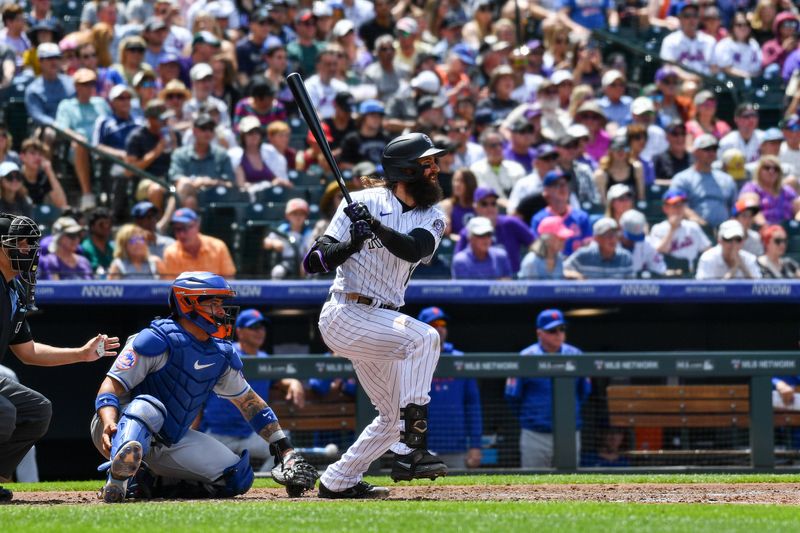 May 28, 2023; Denver, Colorado, USA; Colorado Rockies designated hitter Charlie Blackmon (19) singles in the fourth inning against the New York Mets at Coors Field. Mandatory Credit: John Leyba-USA TODAY Sports