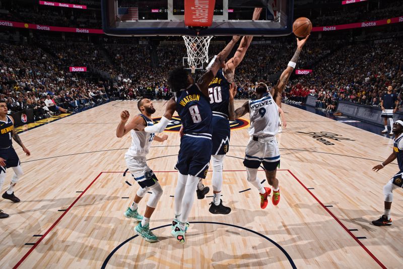 DENVER, CO - APRIL 10: Nickeil Alexander-Walker #9 of the Minnesota Timberwolves drives to the basket during the game against the Denver Nuggets on April 10, 2024 at the Ball Arena in Denver, Colorado. NOTE TO USER: User expressly acknowledges and agrees that, by downloading and/or using this Photograph, user is consenting to the terms and conditions of the Getty Images License Agreement. Mandatory Copyright Notice: Copyright 2024 NBAE (Photo by Garrett Ellwood/NBAE via Getty Images)