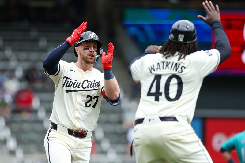 May 9, 2024; Minneapolis, Minnesota, USA; Minnesota Twins Ryan Jeffers (27) celebrates his solo home run with third base coach Tommy Watkins (40) during the second inning against the Seattle Mariners at Target Field. Mandatory Credit: Matt Krohn-USA TODAY Sports