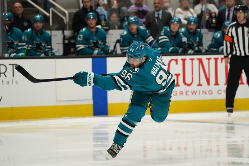 Nov 25, 2024; San Jose, California, USA; San Jose Sharks defenseman Jake Walman (96) takes a shot on goal against the Los Angeles Kings in the second period at SAP Center at San Jose. Mandatory Credit: David Gonzales-Imagn Images
