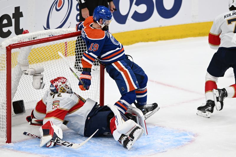 Jun 13, 2024; Edmonton, Alberta, CAN; Edmonton Oilers center Adam Henrique (19) collides with Florida Panthers goaltender Sergei Bobrovsky (72) in the first period in game three of the 2024 Stanley Cup Final at Rogers Place. Mandatory Credit: Walter Tychnowicz-USA TODAY Sports