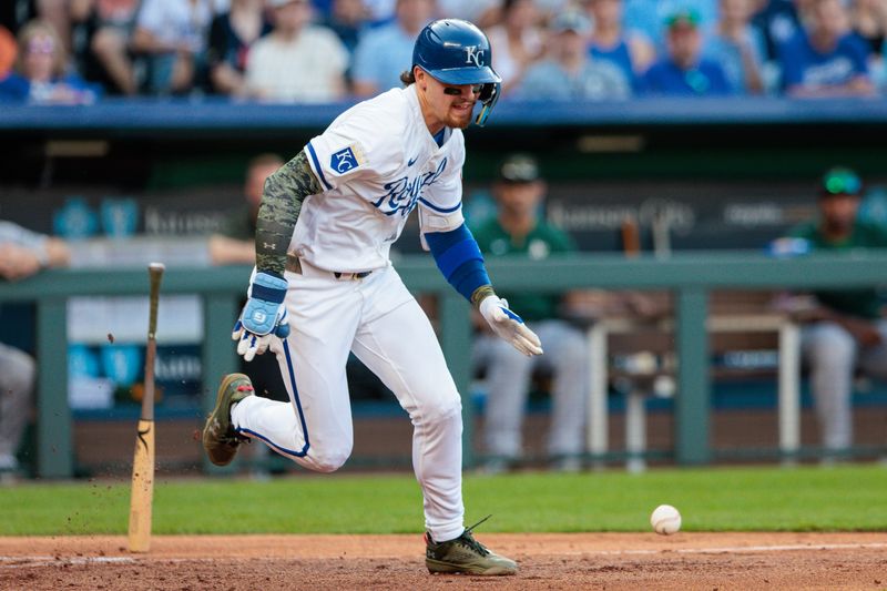 May 18, 2024; Kansas City, Missouri, USA; Kansas City Royals shortstop Bobby Witt Jr. (7) tries to outrun a short hit during the third inning against the Oakland Athletics at Kauffman Stadium. Mandatory Credit: William Purnell-USA TODAY Sports