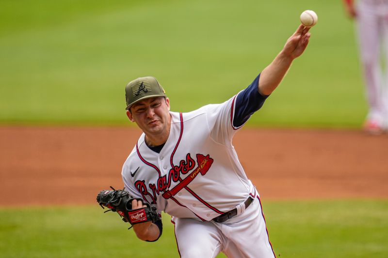 May 21, 2023; Cumberland, Georgia, USA; Atlanta Braves starting pitcher Jared Shuster (45) pitches against the Seattle Mariners during the first inning at Truist Park. Mandatory Credit: Dale Zanine-USA TODAY Sports