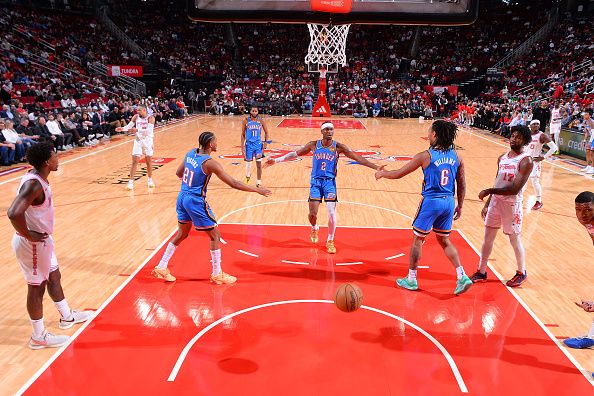 HOUSTON, TX - DECEMBER 6:   Shai Gilgeous-Alexander #2 of the Oklahoma City Thunder is congratulated after a free throw during the game against the Houston Rockets on December 6, 2023 at the Toyota Center in Houston, Texas. NOTE TO USER: User expressly acknowledges and agrees that, by downloading and or using this photograph, User is consenting to the terms and conditions of the Getty Images License Agreement. Mandatory Copyright Notice: Copyright 2023 NBAE (Photo by Michael Gonzales/NBAE via Getty Images)