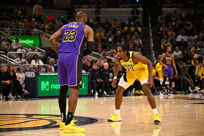 INDIANAPOLIS, IN - MARCH 29: Aaron Nesmith #23 of the Indiana Pacers plays defense against LeBron James #23 of the Los Angeles Lakers during the game on March 24, 2024 at Gainbridge Fieldhouse in Indianapolis, Indiana. NOTE TO USER: User expressly acknowledges and agrees that, by downloading and or using this Photograph, user is consenting to the terms and conditions of the Getty Images License Agreement. Mandatory Copyright Notice: Copyright 2024 NBAE (Photo by David Dow/NBAE via Getty Images)