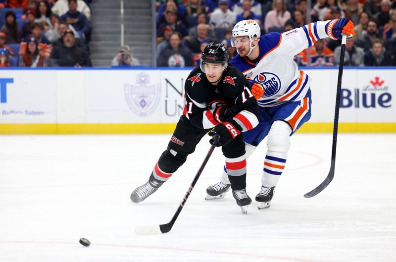 Mar 10, 2025; Buffalo, New York, USA;  Buffalo Sabres center Ryan McLeod (71) and Edmonton Oilers left wing Zach Hyman (18) go after a loose puck during the second period at KeyBank Center. Mandatory Credit: Timothy T. Ludwig-Imagn Images