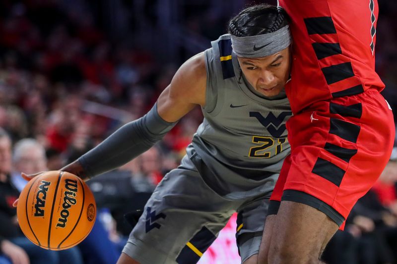 Mar 9, 2024; Cincinnati, Ohio, USA; West Virginia Mountaineers guard RaeQuan Battle (21) dribbles against the Cincinnati Bearcats in the second half at Fifth Third Arena. Mandatory Credit: Katie Stratman-USA TODAY Sports