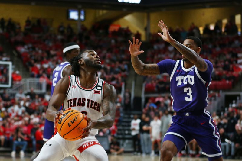 Feb 20, 2024; Lubbock, Texas, USA;  Texas Tech Red Raiders guard Joe Toussaint (6) stops to shoot against TCU Horned Frogs guard Avery Anderson III (3) in the first half at United Supermarkets Arena. Mandatory Credit: Michael C. Johnson-USA TODAY Sports