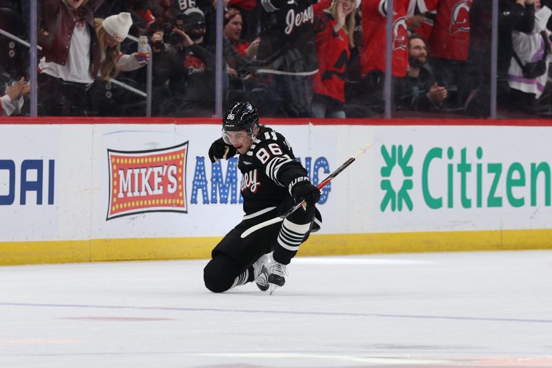 Dec 21, 2025; Newark, New Jersey, USA;  New Jersey Devils center Jack Hughes (86) celebrates his goal against the Buffalo Sabres during the first period at Prudential Center. Mandatory Credit: Thomas Salus-Imagn Images