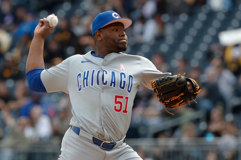 May 12, 2024; Pittsburgh, Pennsylvania, USA;  Chicago Cubs relief pitcher Héctor Neris (51) pitches against the Pittsburgh Pirates during the ninth inning at PNC Park. The Cubs won 5-4 in ten innings. Mandatory Credit: Charles LeClaire-USA TODAY Sports