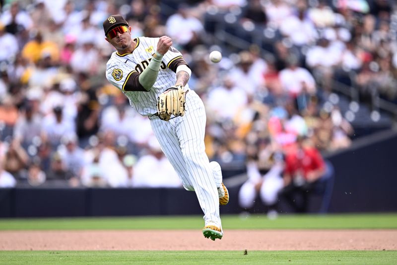 May 1, 2024; San Diego, California, USA; San Diego Padres third baseman Manny Machado (13) throws to first base on a ground out by Cincinnati Reds second baseman Jonathan India (not pictured) during the ninth inning at Petco Park. Mandatory Credit: Orlando Ramirez-USA TODAY Sports