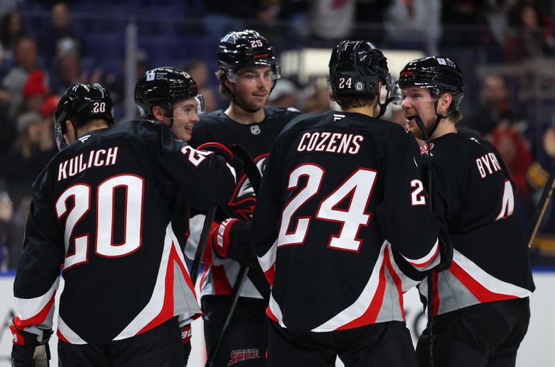 Oct 26, 2024; Buffalo, New York, USA;  Buffalo Sabres defenseman Bowen Byram (4) celebrates his goal with teammates during the second period against the Detroit Red Wings at KeyBank Center. Mandatory Credit: Timothy T. Ludwig-Imagn Images