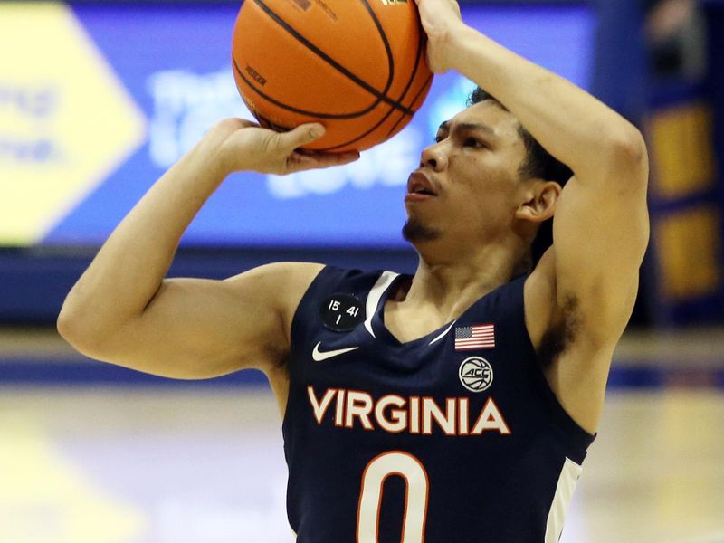 Jan 3, 2023; Pittsburgh, Pennsylvania, USA; Virginia Cavaliers guard Kihei Clark (0) shoots a three point basket against the Pittsburgh Panthers during the first half at the Petersen Events Center. Mandatory Credit: Charles LeClaire-USA TODAY Sports