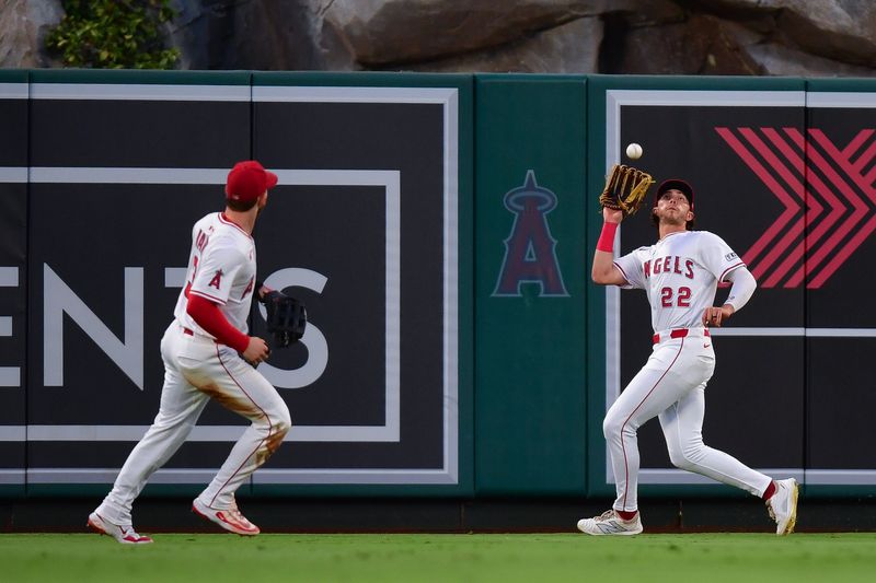 Sep 9, 2025; Anaheim, California, USA; Los Angeles Angels center fielder Bryce Teodosio (22) catches the fly ball of Minnesota Twins shortstop Brooks Lee (2) during the second inning at Angel Stadium. Mandatory Credit: Gary A. Vasquez-Imagn Images