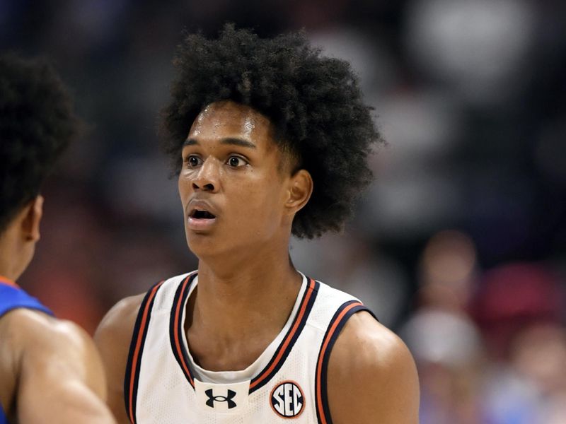 Mar 17, 2024; Nashville, TN, USA;  Auburn Tigers guard Aden Holloway (1) controls the ball in the second half against the Florida Gators in the SEC Tournament championship game at Bridgestone Arena. Mandatory Credit: Steve Roberts-USA TODAY Sports