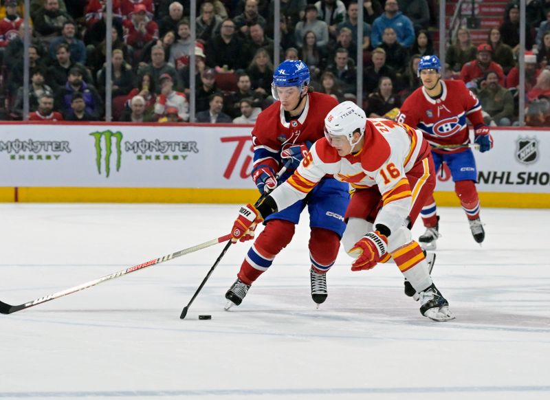 Nov 14, 2023; Montreal, Quebec, CAN; Montreal Canadiens forward Jake Evans (71) goes around Calgary Flames defenseman Nikita Zadorov (16) during the first period at the Bell Centre. Mandatory Credit: Eric Bolte-USA TODAY Sports