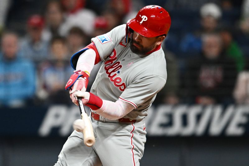 May 11, 2025; Cleveland, Ohio, USA; Philadelphia Phillies designated hitter Kyle Schwarber (12) hits a home run during the eighth inning against the Cleveland Guardians at Progressive Field. Mandatory Credit: Ken Blaze-Imagn Images