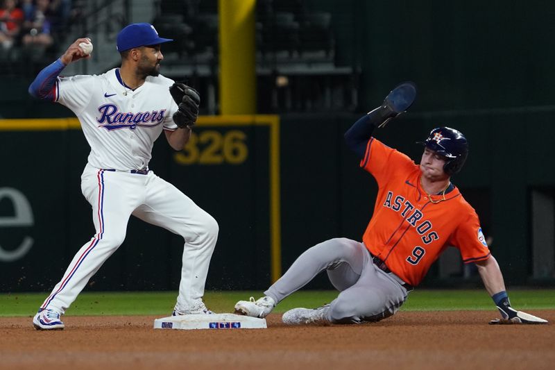 May 15, 2025; Arlington, Texas, USA; Houston Astros outfielder Zach Dezenzo (9) is forced out at second base as Texas Rangers second baseman Marcus Semien (2) is unable to turn the double play during the seventh inning at Globe Life Field. Mandatory Credit: Raymond Carlin III-Imagn Images