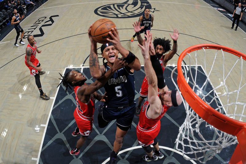 ORLANDO, FL - FEBRUARY 10: Paolo Banchero #5 of the Orlando Magic shoots the ball during the game against the Chicago Bulls  on February 10, 2024 at the Kia Center in Orlando, Florida. NOTE TO USER: User expressly acknowledges and agrees that, by downloading and or using this photograph, User is consenting to the terms and conditions of the Getty Images License Agreement. Mandatory Copyright Notice: Copyright 2024 NBAE (Photo by Fernando Medina/NBAE via Getty Images)