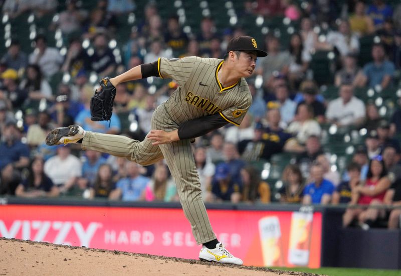 Jun 8, 2025; Milwaukee, Wisconsin, USA; San Diego Padres pitcher Yuki Matsui (1) delivers a pitch against the Milwaukee Brewers in the sixth inning at American Family Field. Mandatory Credit: Michael McLoone-Imagn Images