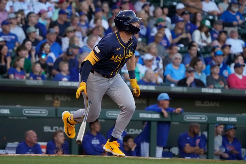 Mar 12, 2024; Mesa, Arizona, USA; Milwaukee Brewers center fielder Garrett Mitchell (5) hits a double against the Chicago Cubs in the first inning at Sloan Park. Mandatory Credit: Rick Scuteri-USA TODAY Sports