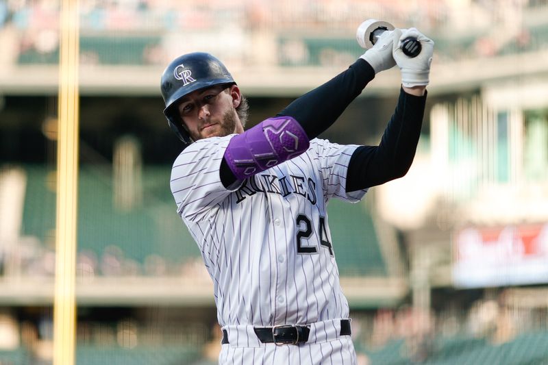 Apr 9, 2025; Denver, Colorado, USA; Colorado Rockies third baseman Ryan McMahon (24) on deck in the first inning against the Milwaukee Brewers at Coors Field. Mandatory Credit: Isaiah J. Downing-Imagn Images