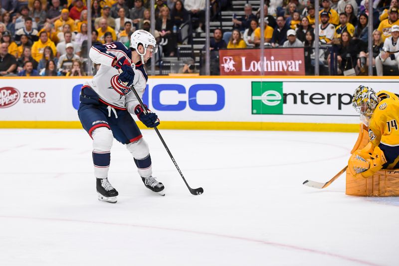 Apr 13, 2024; Nashville, Tennessee, USA; Columbus Blue Jackets center Alexandre Texier (42) shoots and scores against the Nashville Predators during the second period at Bridgestone Arena. Mandatory Credit: Steve Roberts-USA TODAY Sports