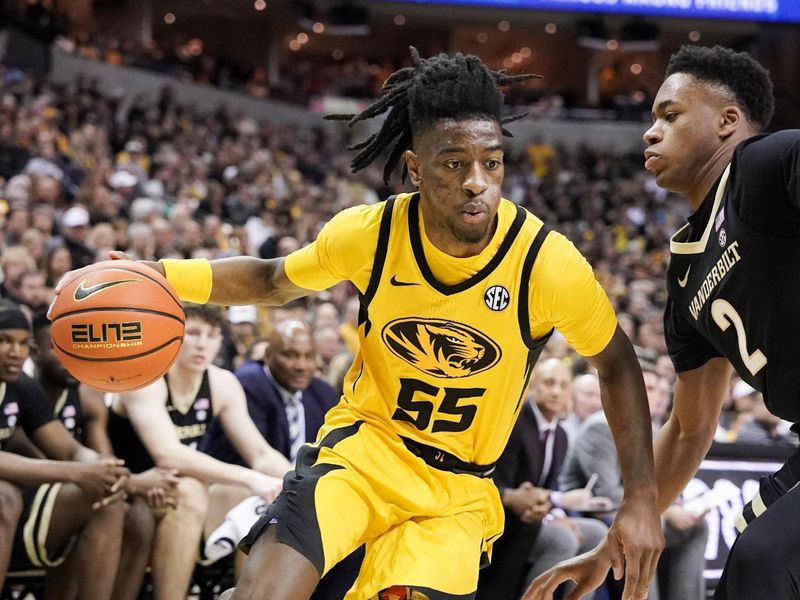 Jan 7, 2023; Columbia, Missouri, USA; Missouri Tigers guard Sean East II (55) dribbles the ball as Vanderbilt Commodores guard Noah Shelby (2) defends during the first half at Mizzou Arena. Mandatory Credit: Denny Medley-USA TODAY Sports