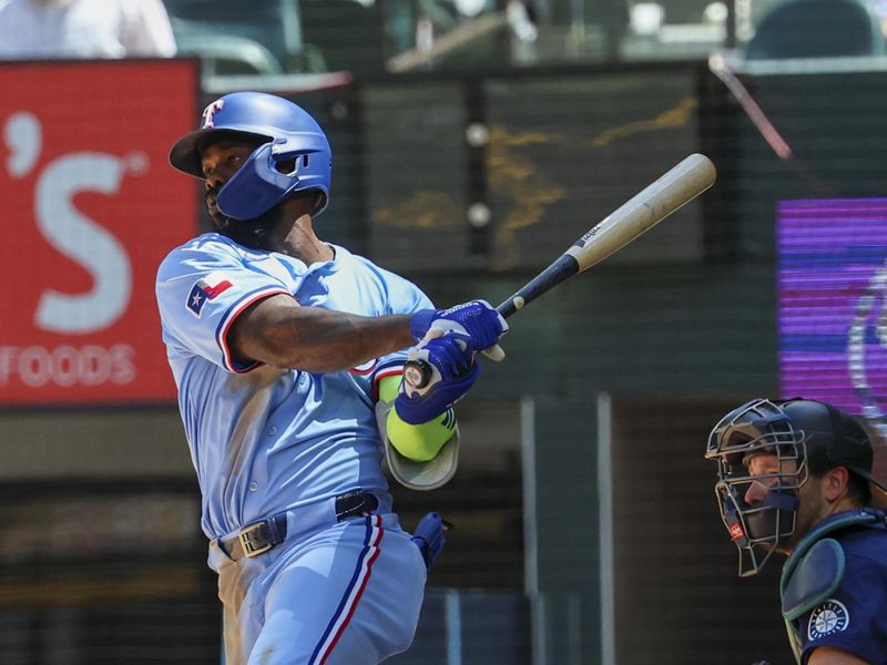 May 4, 2025; Arlington, Texas, USA;  Texas Rangers right fielder Adolis Garcia (53) hits a two-run single during the third inning against the Seattle Mariners at Globe Life Field. Mandatory Credit: Kevin Jairaj-Imagn Images